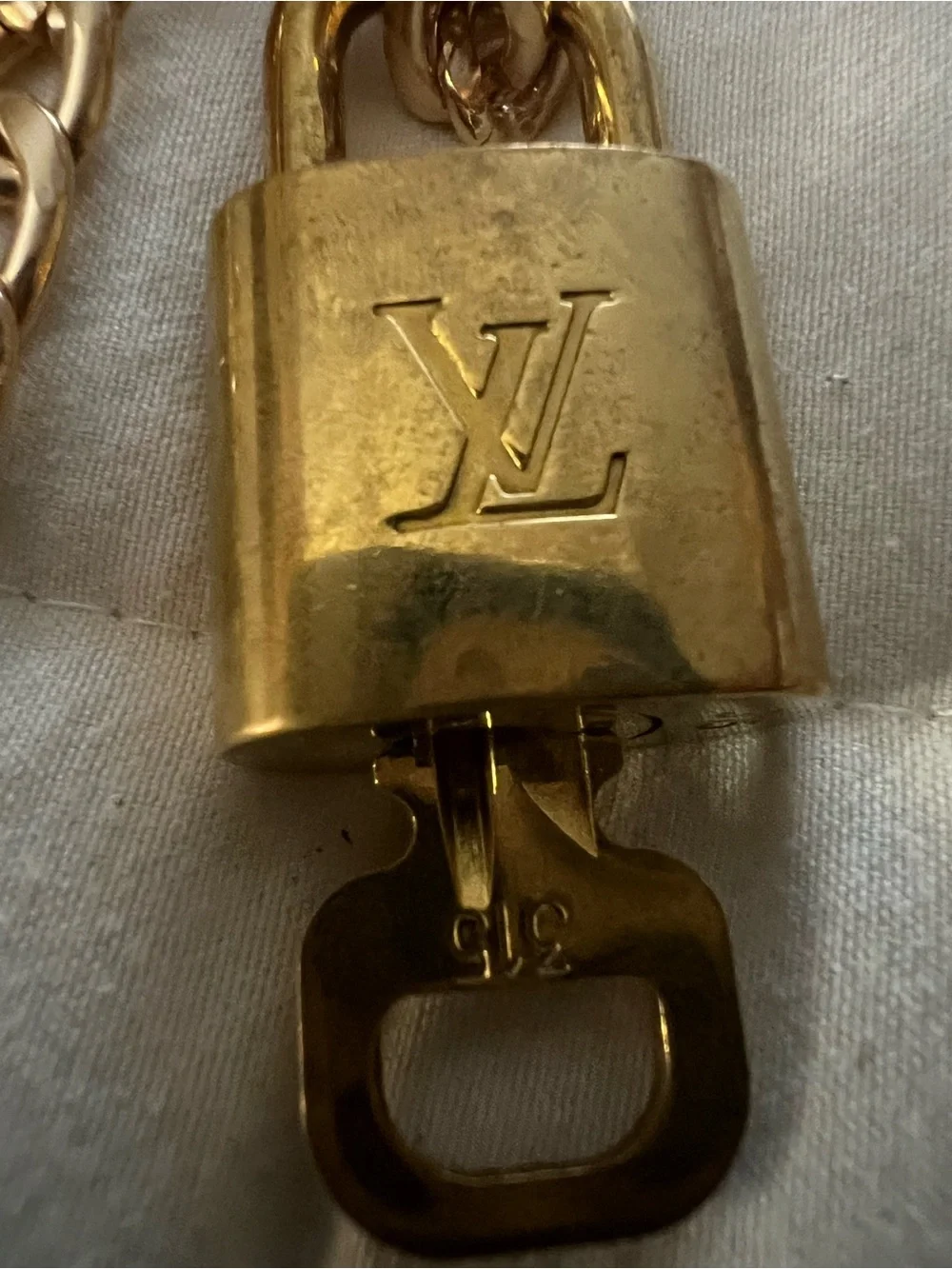 Louis Vuitton Gold Padlock and key with LV Logo